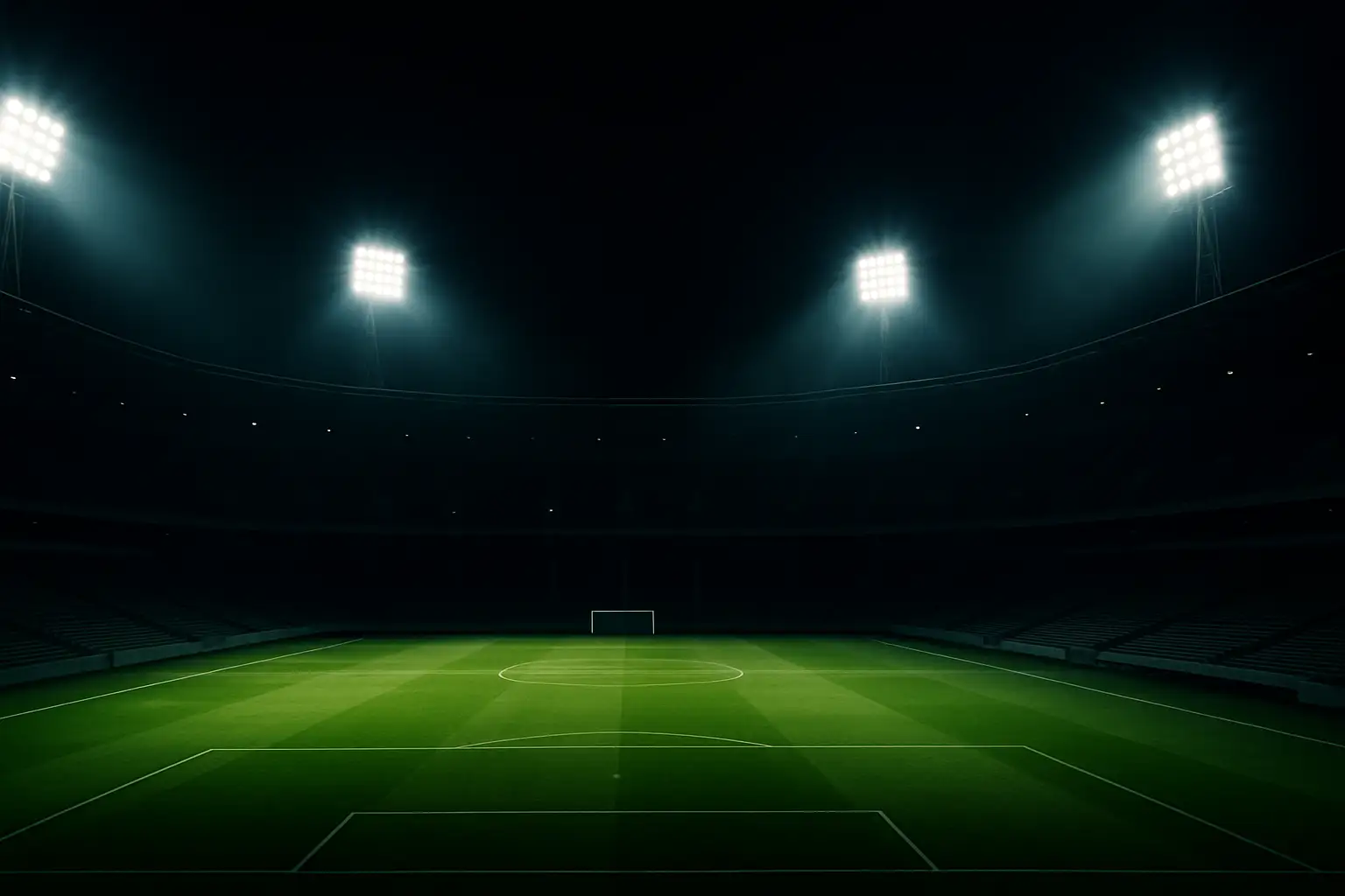 A football stadium lit up at night with an empty pitch under floodlights, symbolizing tension in global football leadership