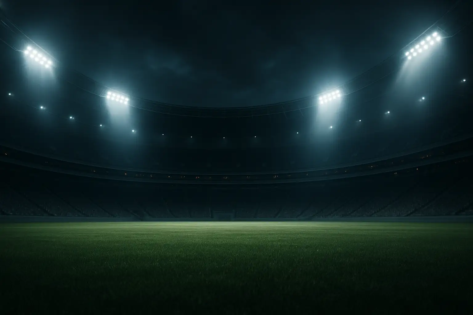 Football stadium at night with dramatic security lighting and an empty pitch